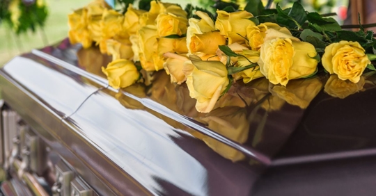 flowers on top of casket
